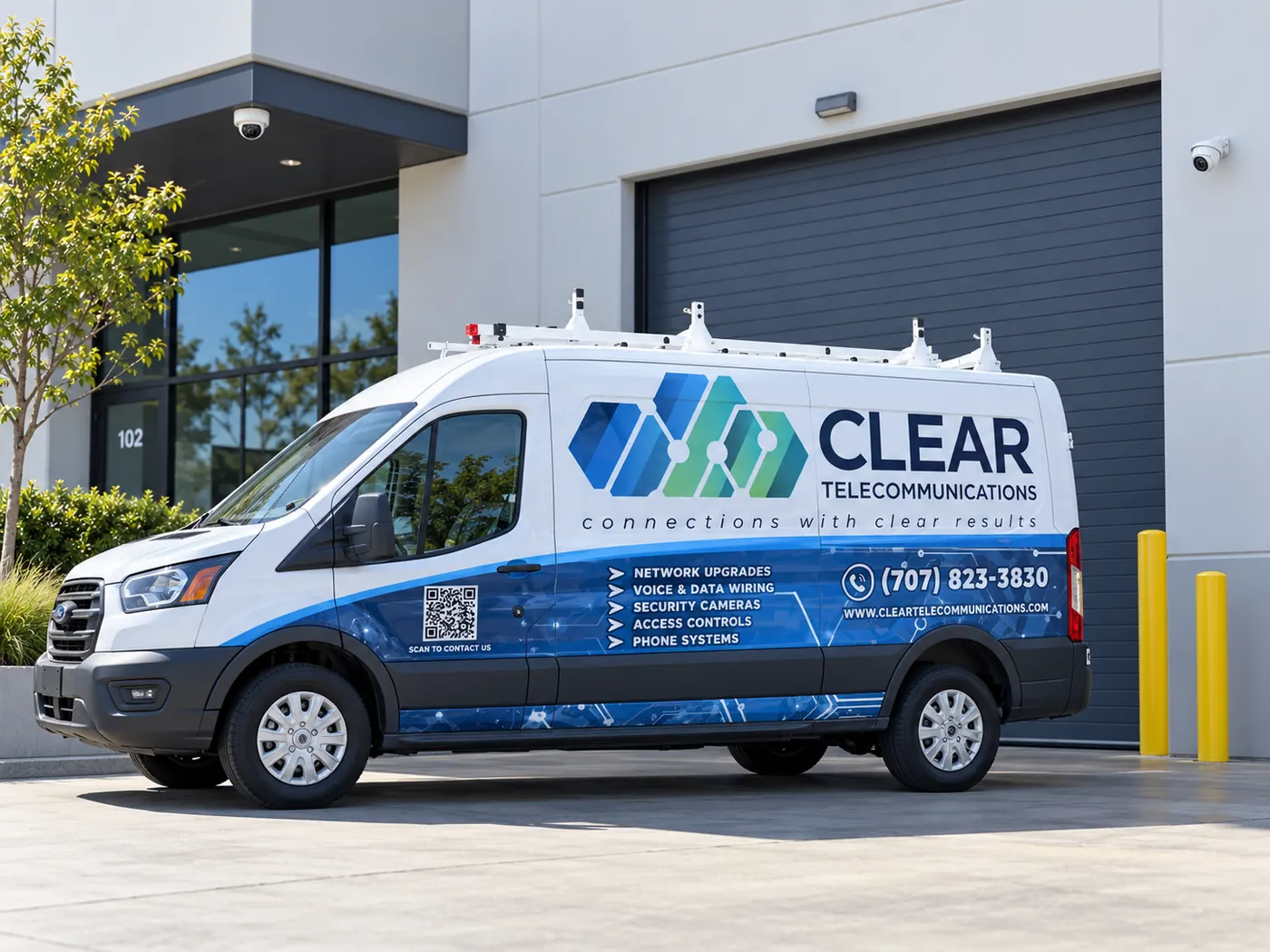 Clear Telecommunications service van with a blue branded wrap