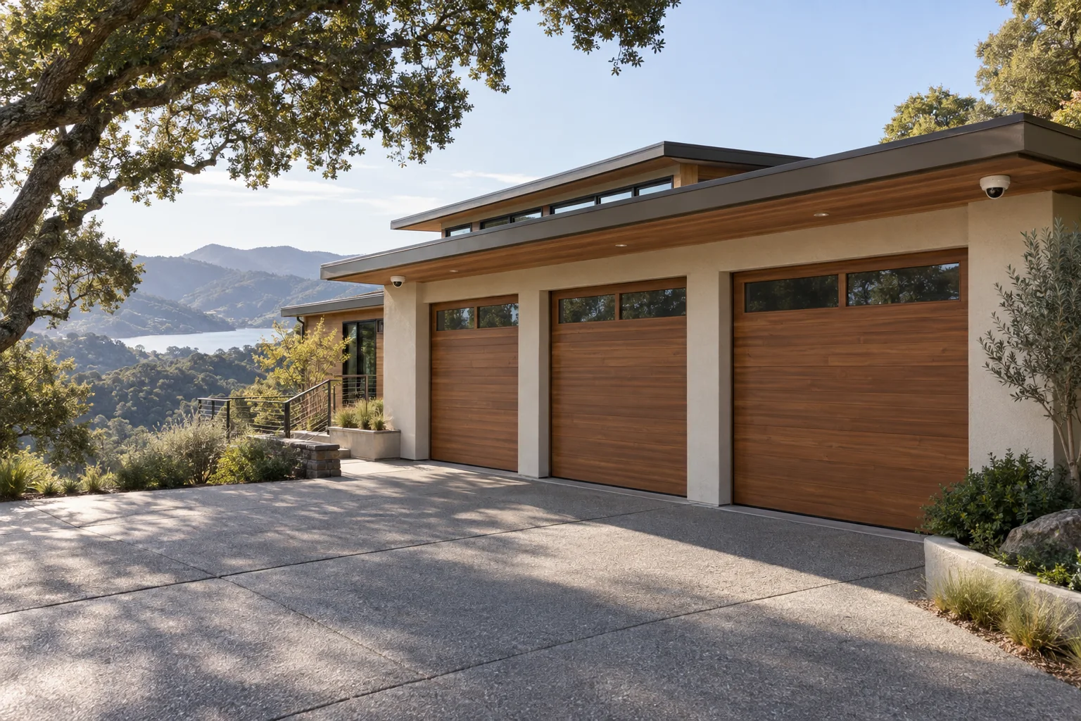 Marin-inspired hillside home with dome cameras protecting a three-car garage and driveway